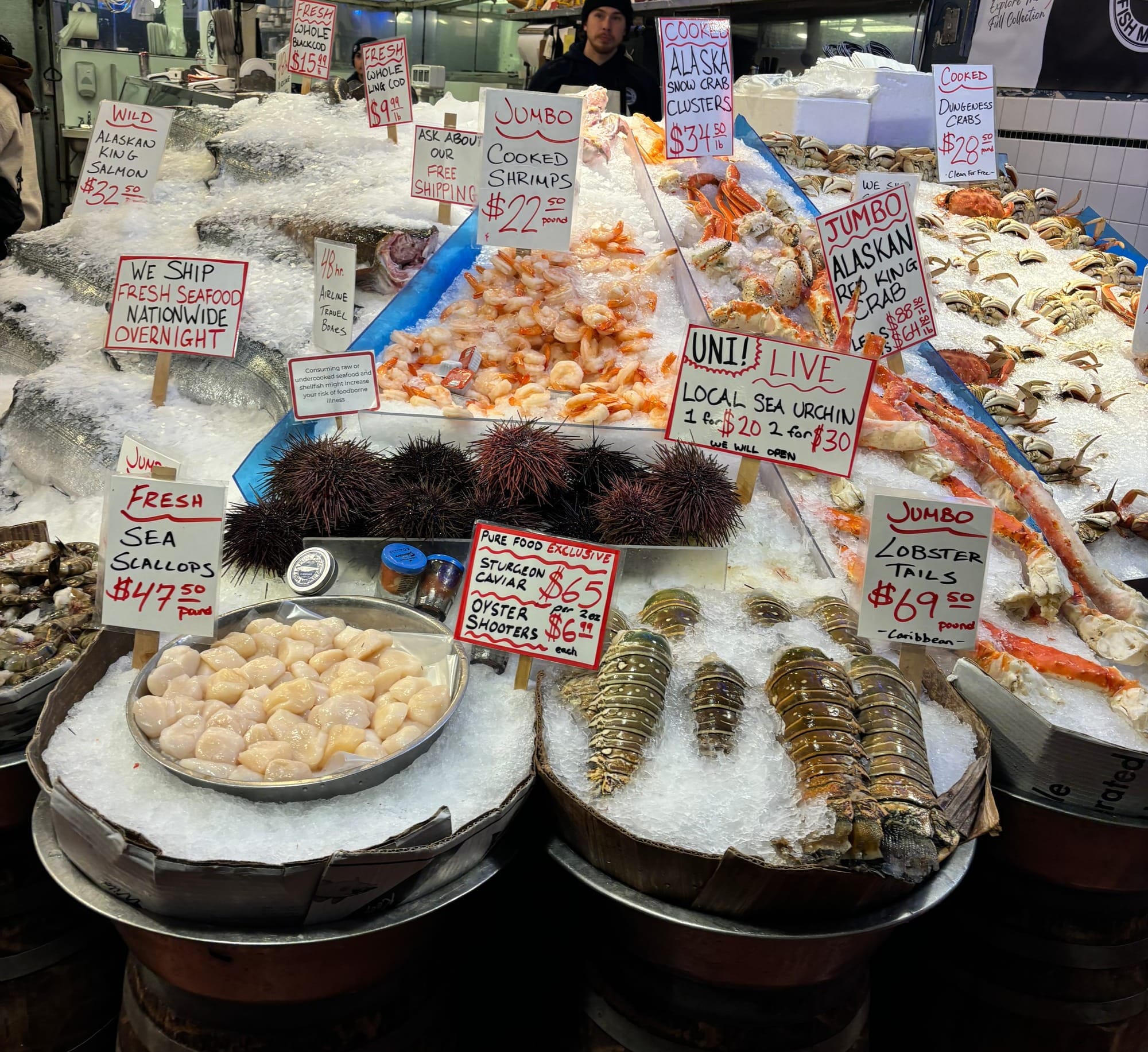 A seafood vendor at Pike Place Market in Seattle